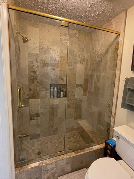 Shower glass with header